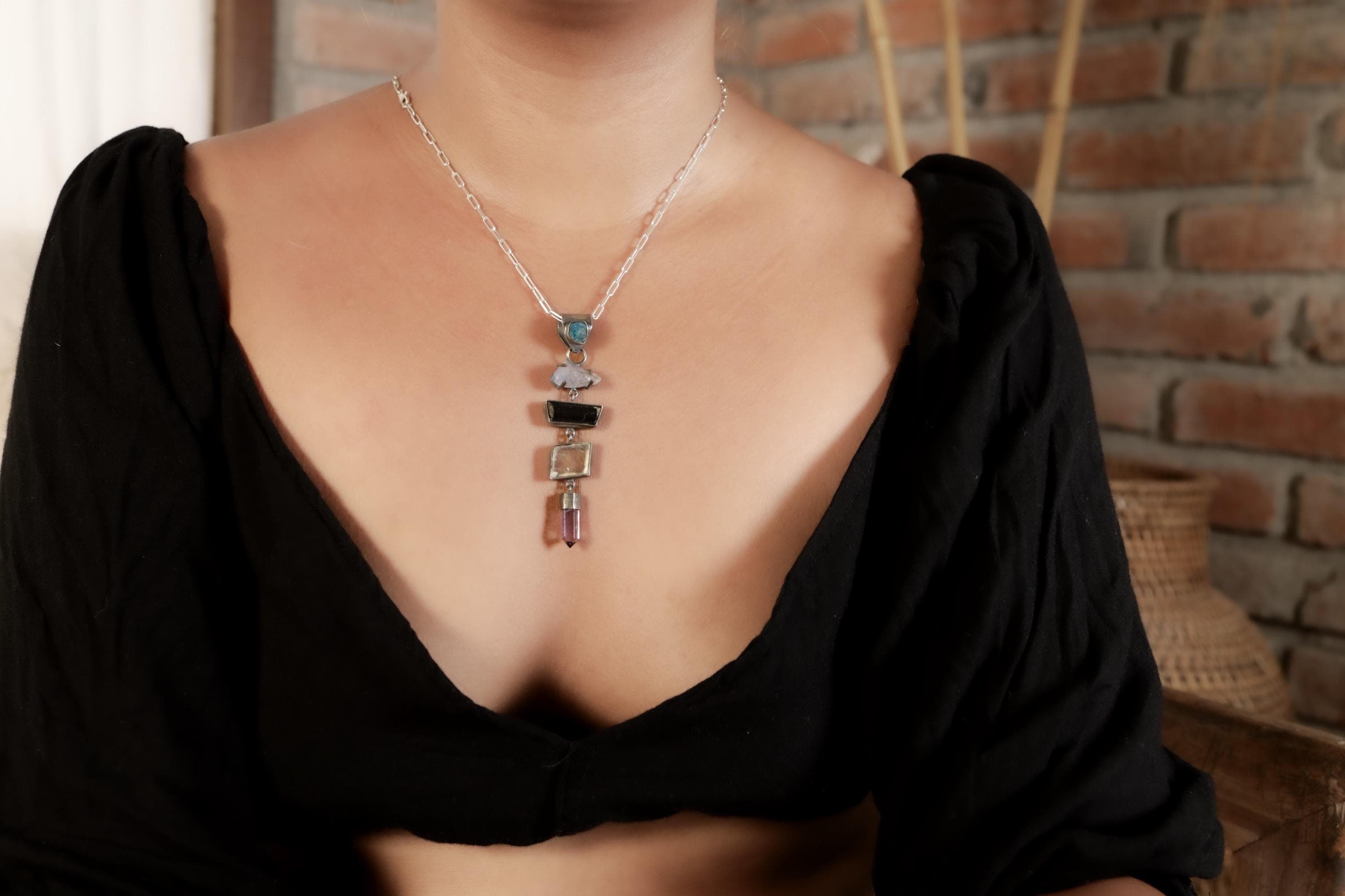 Apatite Tanzanite Tourmaline Selenite Amethyst pendant shown worn on the chest, with oxidized 925 sterling silver and layered stones.