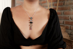 Apatite Tanzanite Tourmaline Selenite Amethyst pendant shown worn on the chest, with oxidized 925 sterling silver and layered stones.