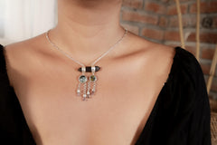 Smoky Quartz Turquoise Amethyst necklace shown worn on the chest, with sterling silver dreamcatcher-style dangles.