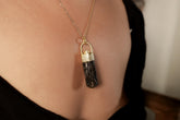 Himalayan Dravite Diamond pendant shown worn on a necklace, with 18k gold-plated sterling silver and dark earthy crystal body.
