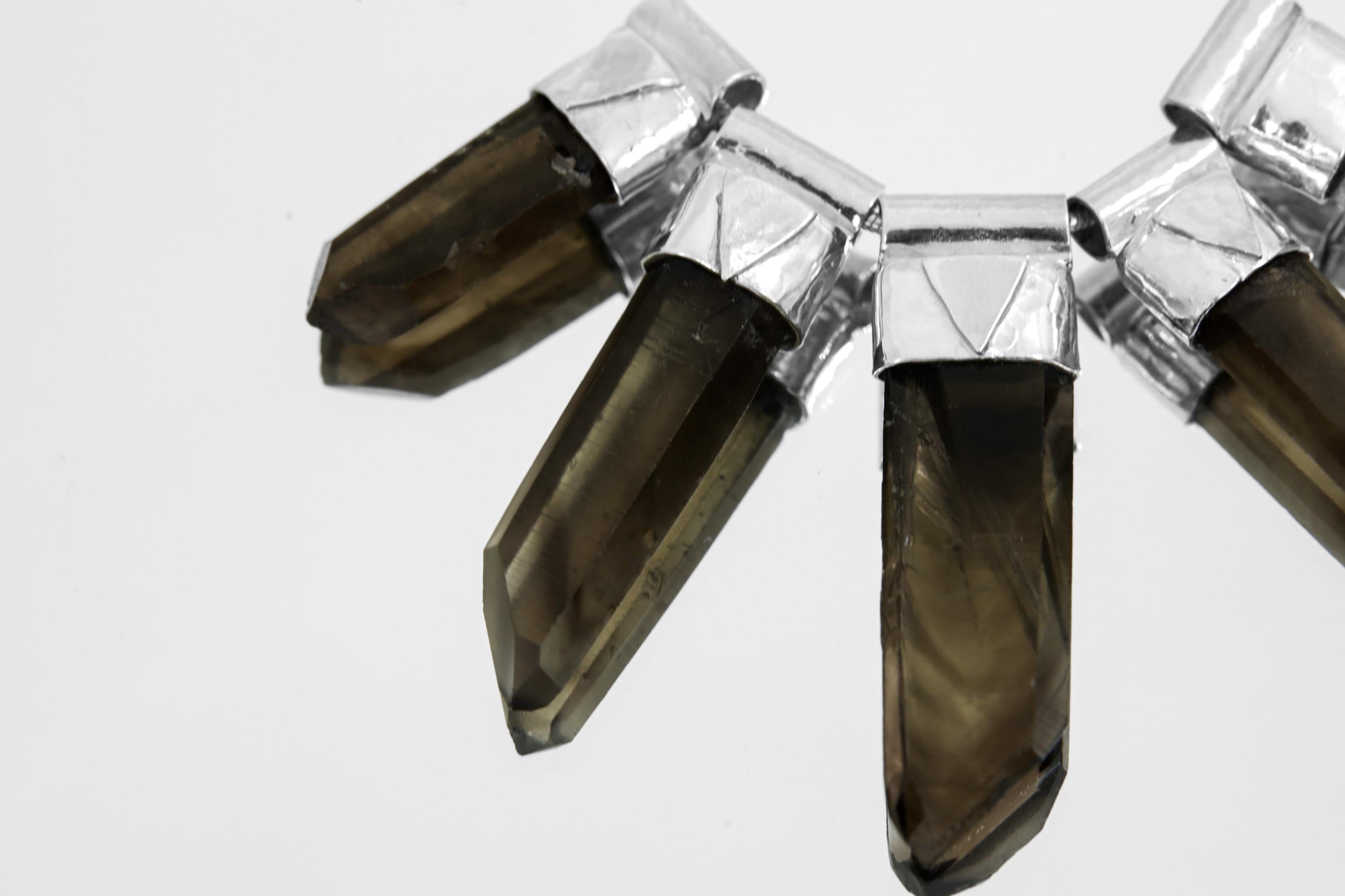 Close-up of five Australian Smoky Citrine Phantom Quartz crystals showing natural phantom inclusions and earthy colour variation.