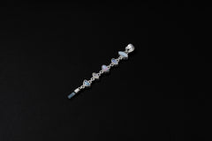 Multi-stone Opal Moonstone Aquamarine pendant on black background with textured 925 sterling silver and vertical cascade design.