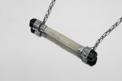 Close-up of antique bone centerpiece with polished Black Tourmaline end stones in an oxidized sterling silver pendant.