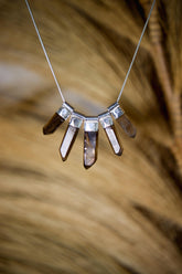 Australian Smoky Citrine Phantom Quartz necklace shown on natural background with five cascading crystal drops and sterling silver chain.