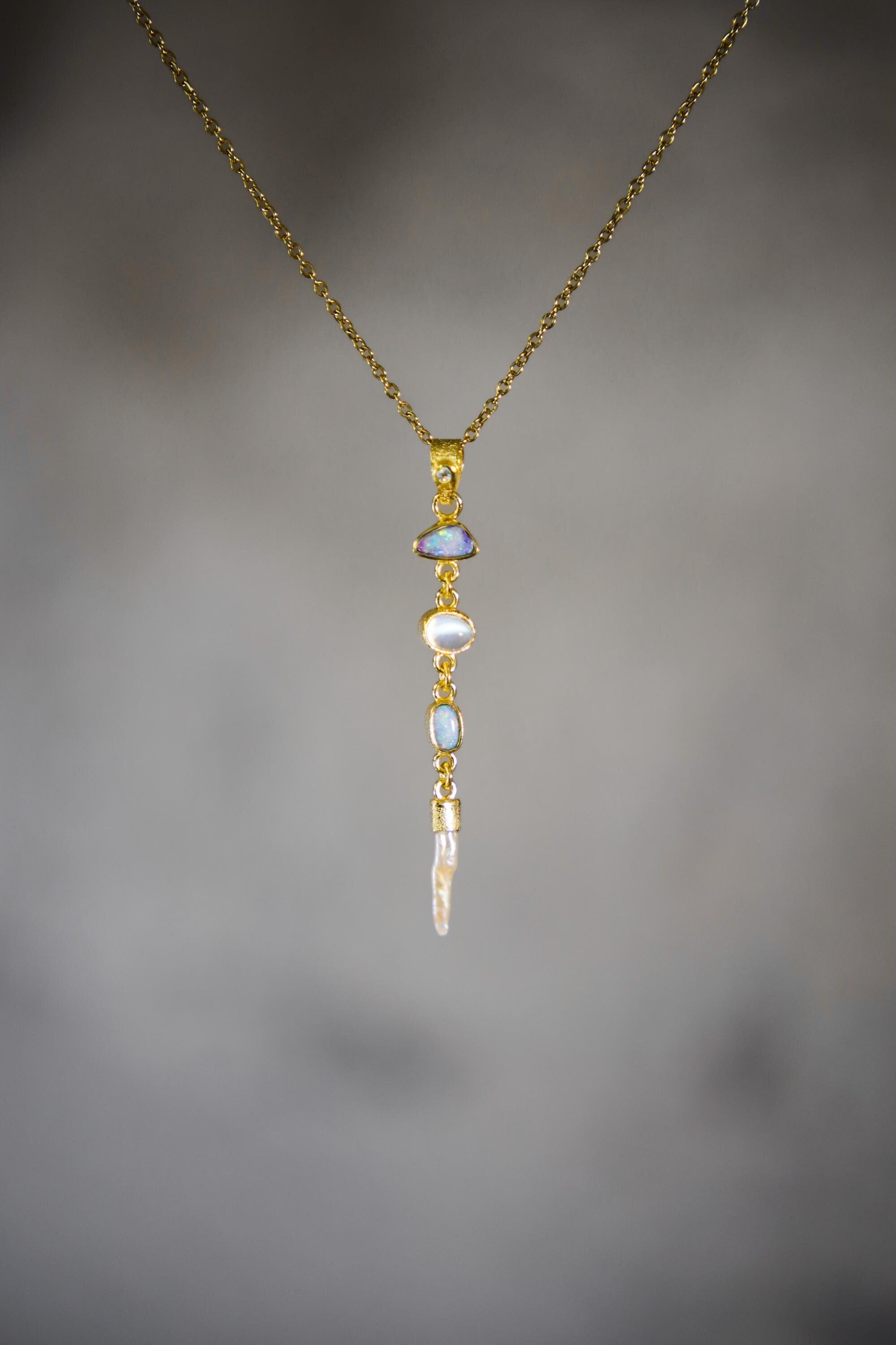 Zircon Opal Moonstone Pearl pendant shown on a gold-toned necklace, with long 18k gold-plated vertical gemstone design.