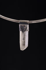Water Clear Nepalese Inclusion Quartz pendant shown worn on a black background with dark oxidized 925 silver cap.