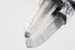 Close-up of Water Clear Nepalese Inclusion Quartz showing natural internal inclusions, bright clarity, and raw crystal texture.