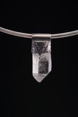 Water Clear Nepalese Inclusion Quartz Pendant shown on black background with oxidized silver cap and raw clear Quartz point.