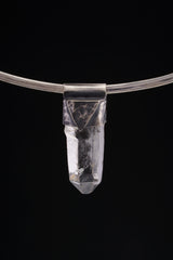 Water Clear Nepalese Inclusion Quartz pendant shown worn on a black background with dark oxidized 925 silver cap.
