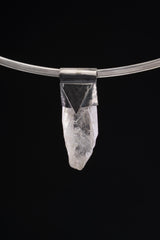 Water Clear Nepalese Inclusion Quartz Pendant shown on black background with oxidized silver cap and clear included crystal body.