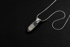 Himalayan Black Rutile Quartz Stack Pendant shown on black background with adjustable black cotton necklace and clear crystal point.