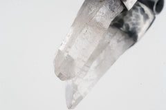Close-up of Water Clear Nepalese Inclusion Quartz with natural internal veils and hand-hammered oxidized silver setting.