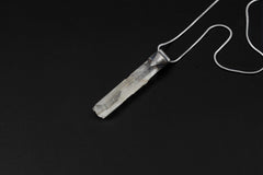 Rainbow Quartz Stack Pendant shown on black background with adjustable black cotton necklace and clear Quartz point.