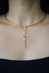 Zircon Aquamarine Australian Opal and Blue Moonstone cascade pendant shown worn on a necklace, with 18k gold-plated sterling silver.