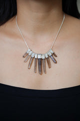 Australian Smoky Citrine Phantom Quartz necklace shown worn on the chest, with eight stacked crystals and sterling silver setting.