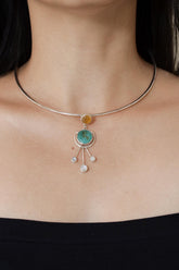 Turquoise Carnelian Moonstone pendant shown worn on the chest, with polished sterling silver and three Moonstone dangles.