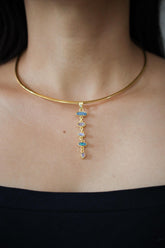 White Zircon Australian Opal Blue Moonstone and Herkimer Diamond pendant shown worn on a necklace, with 18k gold-plated sterling silver.