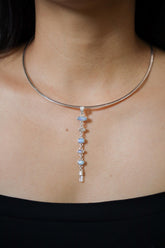 Faceted Zircon Australian Opal Moonstone Aquamarine pendant shown worn on a model, with textured sterling silver and blue gemstone cascade.