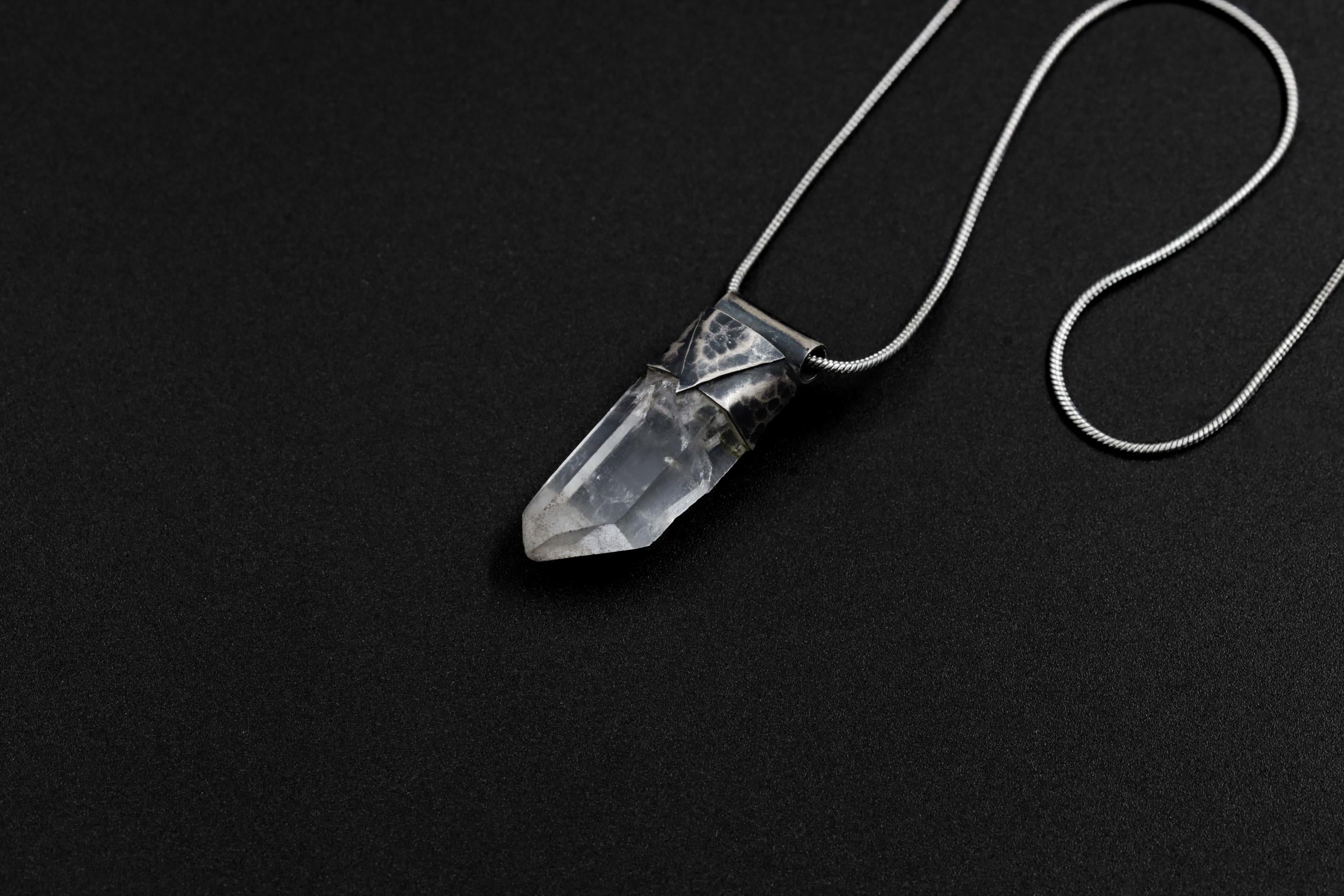 Water Clear Nepalese Inclusion Quartz Stack Pendant shown on black background with oxidized sterling silver cap and black cotton necklace.