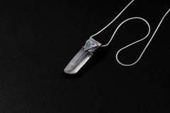 Water Clear Nepalese Inclusion Quartz pendant shown on black background with oxidized sterling silver cap and black cotton necklace.