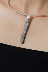 Australian Ocean Kyanite Stack Pendant shown worn on the chest with sterling silver cap and slim blue crystal.