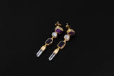 Amethyst, Blue Moonstone, and Clear Quartz gold-plated sterling silver stud drop earrings shown on dark background.