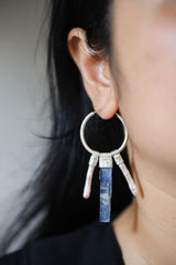 Blue Kyanite Pearl hoop earring worn on a model, showing large silver circle and stacked gemstone movement.