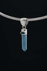 Aqua Aura Quartz Emerald pendant shown on a choker-style necklace with bright blue iridescent crystal point.
