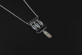 Black Tourmaline Quartz Aquamarine pendant in high-shine 925 sterling silver on a rolo chain, shown on a dark background.