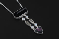 Celestial Pathways Talisman on a dark background, with organic sterling silver setting and vertical multi-stone crystal design.