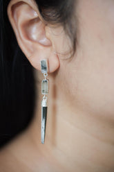 Black Rutile Quartz and Himalayan Chlorite Quartz sterling silver stud drop earrings shown worn on the ear.