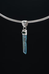 Aqua Veil Emerald Quartz pendant displayed on a choker with Aqua Aura Quartz point and Natural Emerald detail.