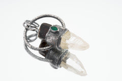 Brown Tourmaline Emerald Lemurian Quartz pendant in oxidized 925 silver, showing circular structure and suspended Quartz point.