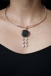 Shungite Blue Moonstone pendant shown worn on the chest, with high-shine 925 sterling silver and twin lunar dangle strands.