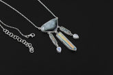 Blue Tourmaline Aquamarine Angel Aura Quartz Moonstone necklace shown on a dark background with sterling silver box chain.