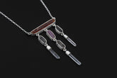Crimson Ascension Talisman shown on a dark background with Red Kyanite, Ruby, Petroleum Smoky Quartz, Clear Quartz, and sterling silver chain.