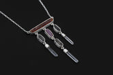 Crimson Ascension Talisman shown on a dark background with Red Kyanite, Ruby, Petroleum Smoky Quartz, Clear Quartz, and sterling silver chain.