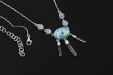 Larimar Blue Moonstone Clear Quartz necklace shown worn on a model, with 925 sterling silver box chain and raw Quartz dangles.