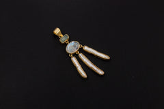Aquamarine Blue Moonstone Stick Pearl pendant shown on a dark background with 18k gold-plated sterling silver setting.