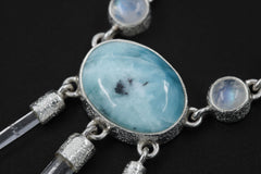 Close-up of Larimar, Blue Moonstone, and raw Clear Quartz necklace in high-shine 925 sterling silver with organic texture.