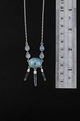 Larimar Blue Moonstone Clear Quartz necklace shown beside a ruler for scale, with a 5.5 cm pendant drop and sterling silver chain.