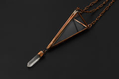Copper Triangle Quartz hanging ornament shown on dark background with glass prism frame and raw crystal drop.