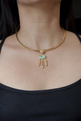 Arizona Turquoise Opal Clear Quartz pendant shown worn on the chest, with 18k gold-plated sterling silver and dangle design.