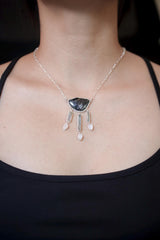 Celestial Waters Cascade necklace shown worn on the chest, with Blue Tourmaline, Aquamarine, Angel Aura Quartz, Moonstone, and sterling silver.