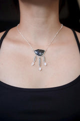 Celestial Waters Cascade necklace shown worn on the chest, with Blue Tourmaline, Aquamarine, Angel Aura Quartz, Moonstone, and sterling silver.