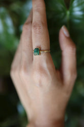 18k gold-plated 925 sterling silver raw Australian Emerald ring shown worn on the hand, with green crystal and hammered band.