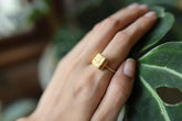 Gold-plated 925 sterling silver Australian Pyrite cube ring shown worn on the hand, with raw golden crystal and slim band.