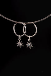 Opal Leaf Whisper Hoops in polished 925 sterling silver displayed on a choker with botanical Opal charms.