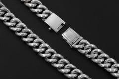 Close view of sterling silver woven bracelet links and secure box clasp with safety latch.