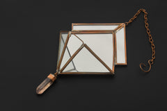 Quartz Reliquary hanging decoration shown on dark background with copper chain, mirrored panels, and crystal drop.
